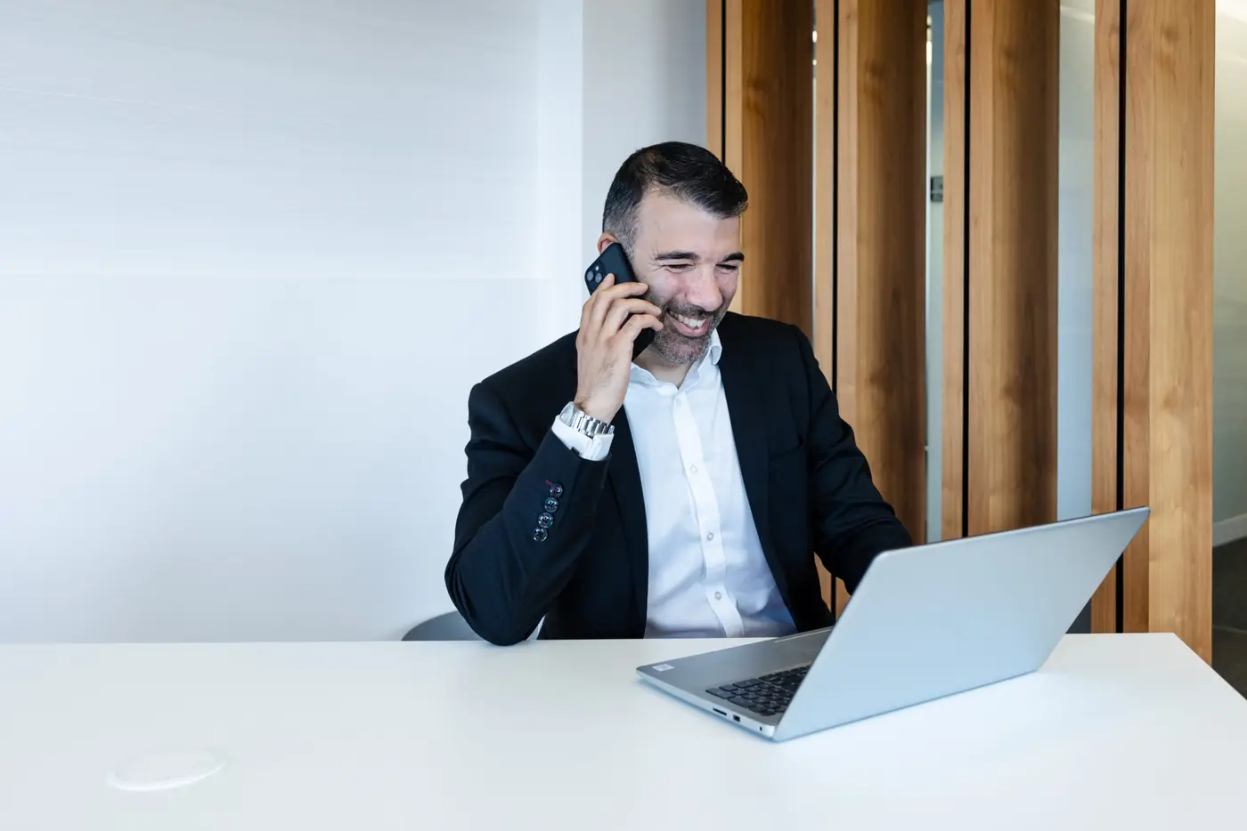 businessman taking call in office